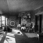 Longfellow and his wife relax on their porch at Edgecliff